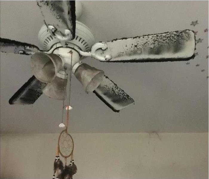 Smoke and soot damaged ceiling fan