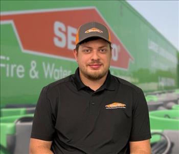 SERVPRO team member in front of new background